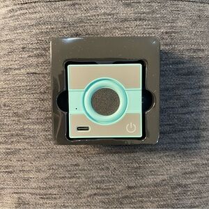 Compact Gray and Blue Electronic Device